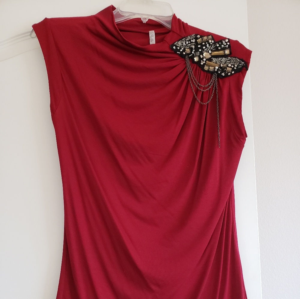 Draped red blouse